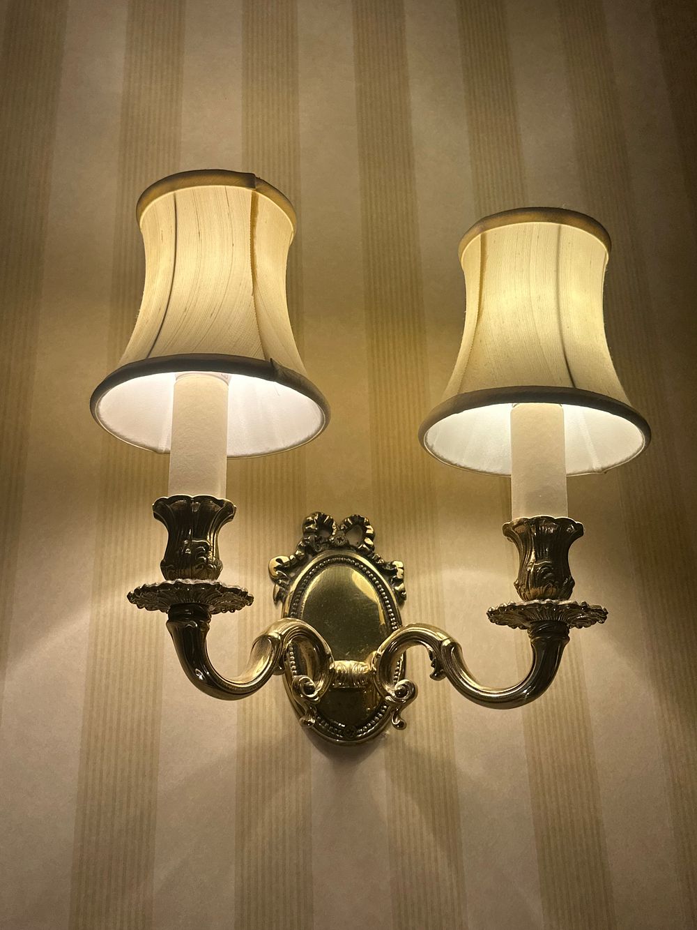 Lot 1152: A Pair of 1920s Colonial Revival Brass Wall Sconces