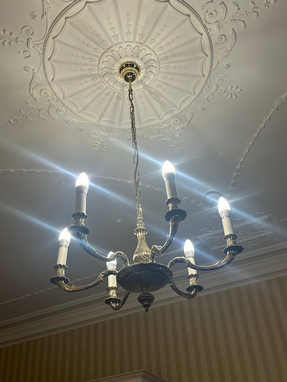 Lot 1153: A Six-Arm Brass-Toned Ceiling Chandelier