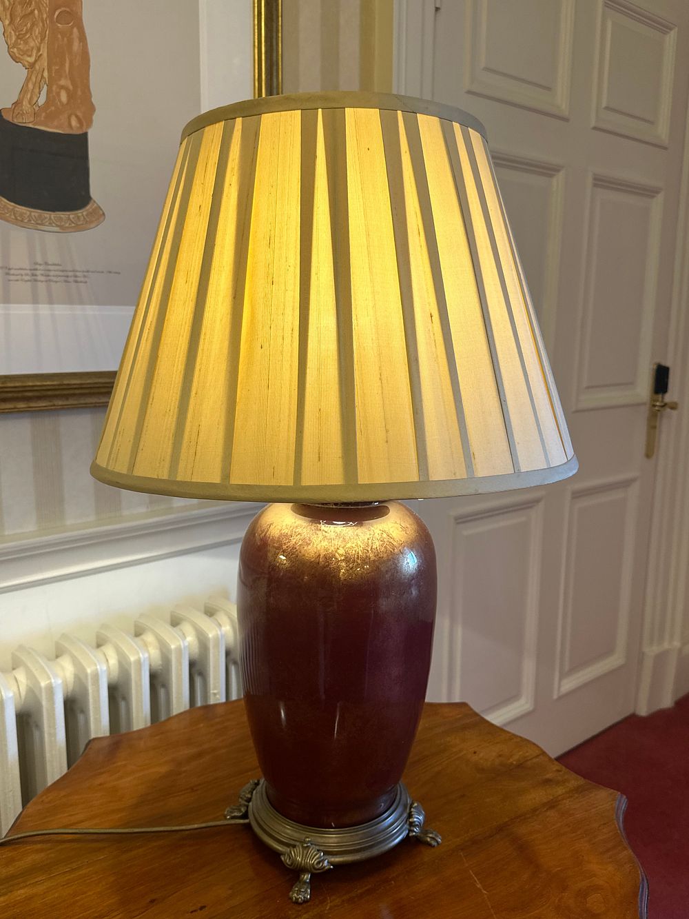 Lot 1156: A Pair of Mid-Century Oxblood Porcelain and Gilt-Metal Table Lamps