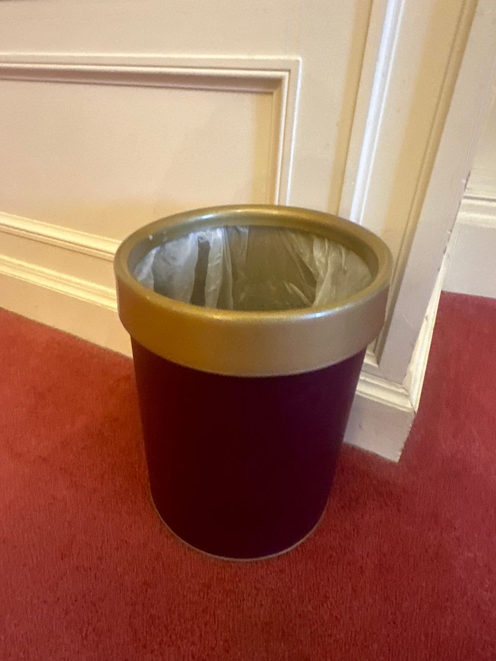 Lot 1161: A Contemporary Burgundy and Gold-Tone Waste Bin