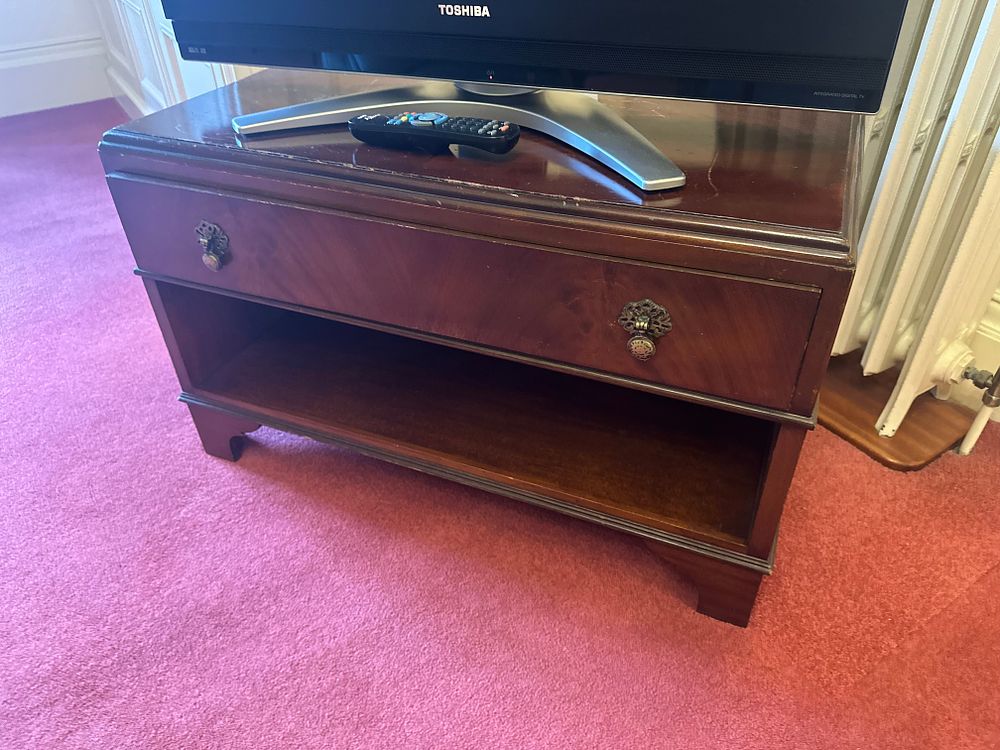 Lot 1167: A Federal Style Mahogany Bedroom Suite, comprising a Bed with Half-Tester Canopy, Low Cabinet, and Bench
