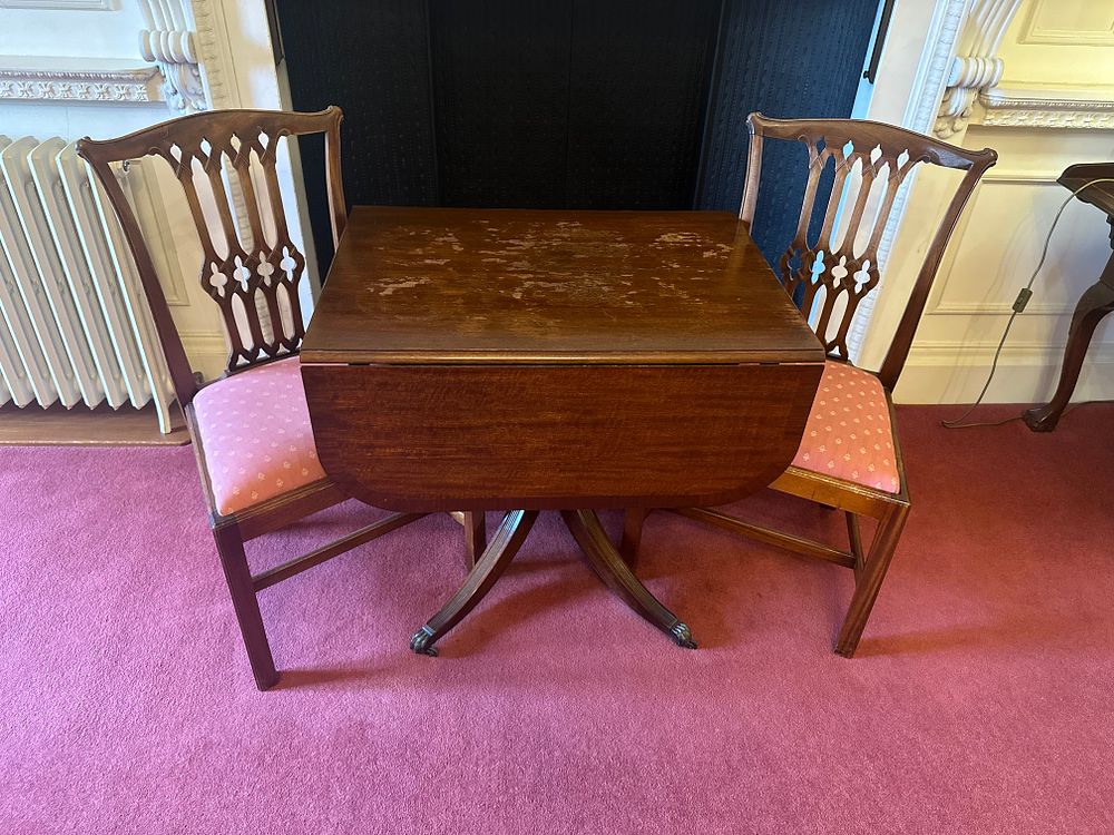 Lot 1177: A Three-Piece Mahogany Drop-Leaf Table and Two Side Chairs