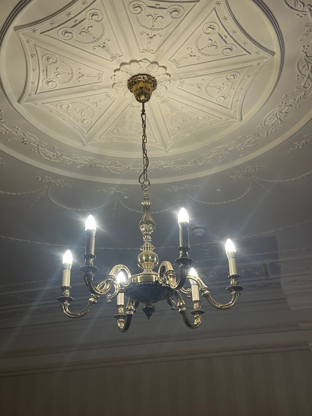 Lot 1182: A Neoclassical Revival Six-Arm Brass Chandelier
