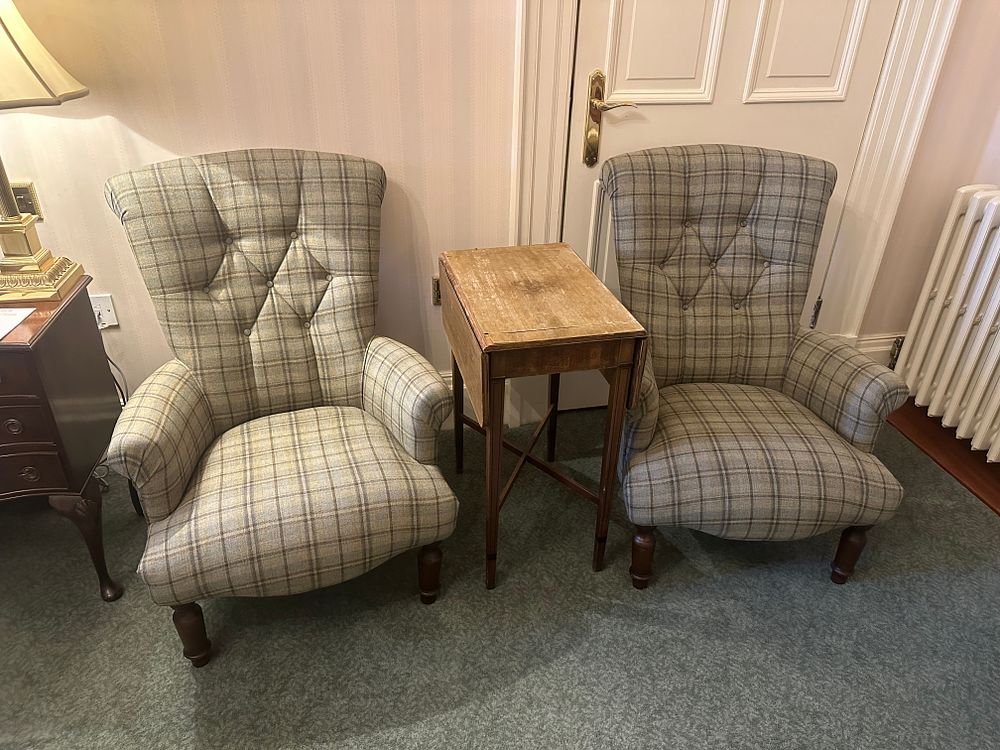 Lot 1200: A Pair of Wingback Armchairs and a Drop-Leaf Side Table