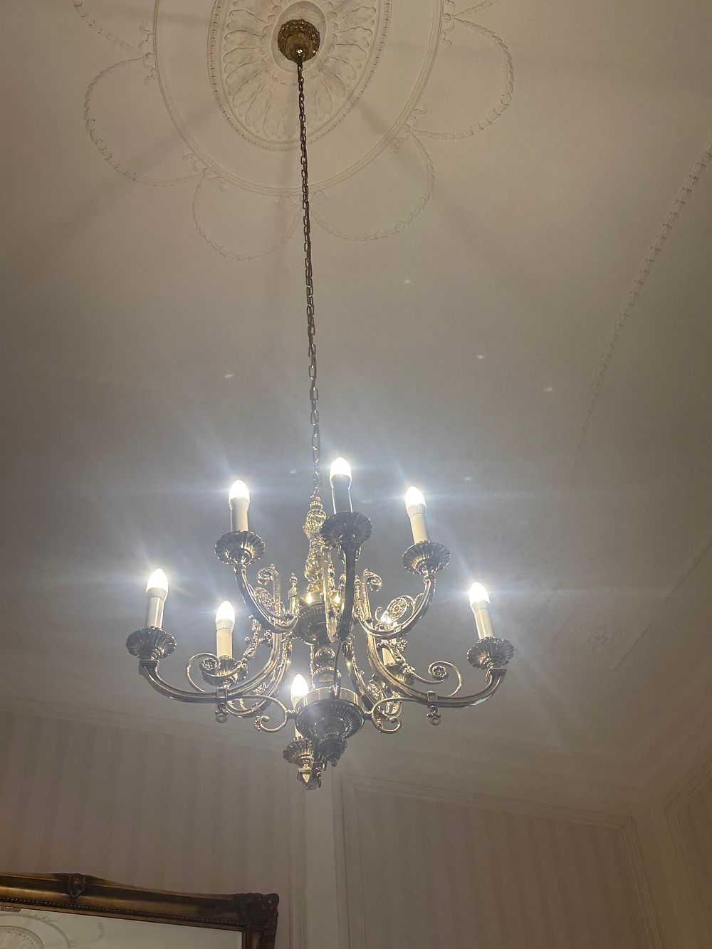 Lot 1221: A Rococo Revival Style Eight-Light Brass-Toned Chandelier