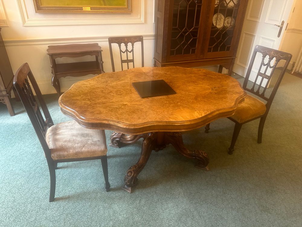 Lot 1231: A Victorian Marquetry Inlaid Burr Walnut Loo Table, circa 1870, with Three Chairs