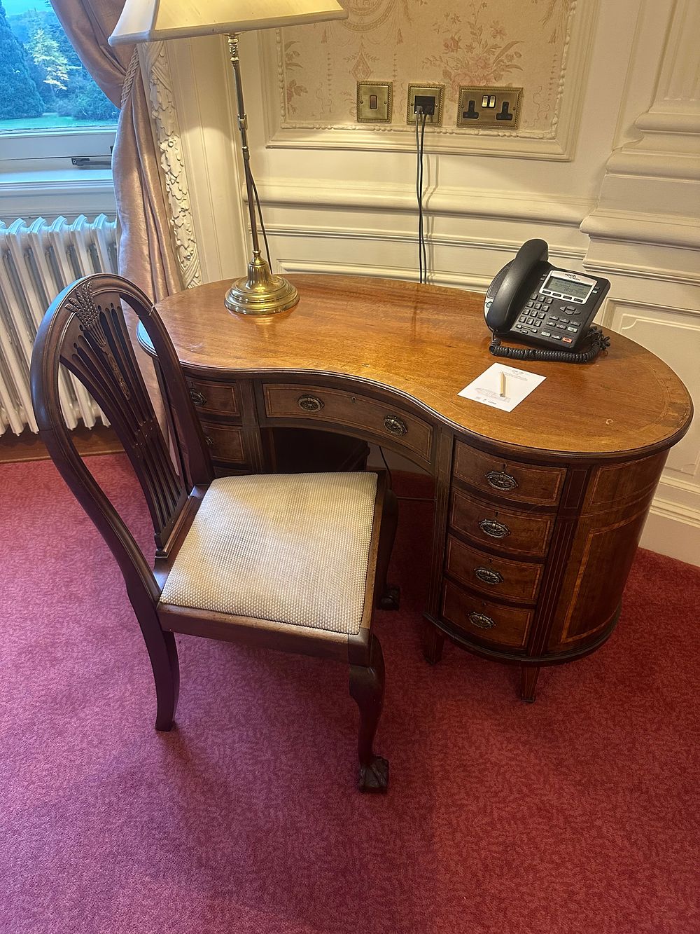 Lot 1247: A Late Georgian/Regency Style Kidney-Shaped Mahogany Pedestal Desk and an Early Georgian Style Mahogany Side Chair