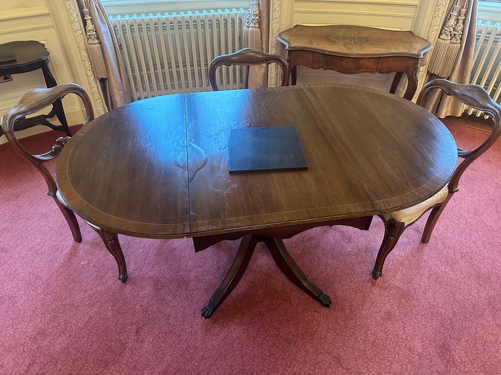 Lot 1248: A George III Style Mahogany Oval Dining Table, Three Rococo Revival Side Chairs, and a Serpentine-Front Console Table