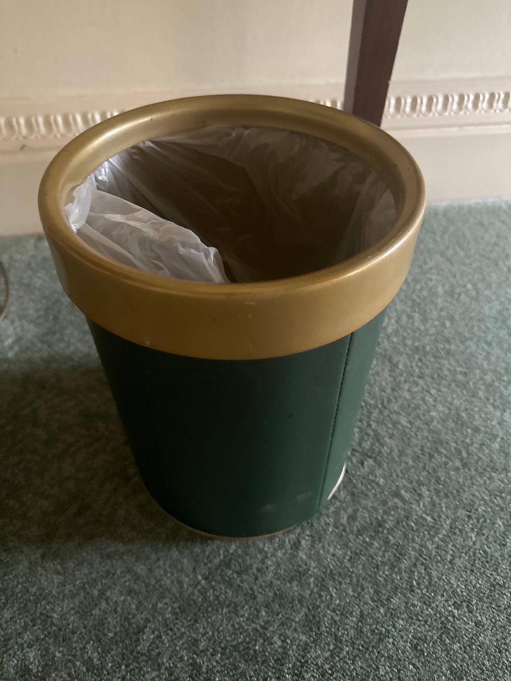 Lot 1279: A Contemporary Dark Green Faux Leather Waste Bin with Brass-Tone Rims