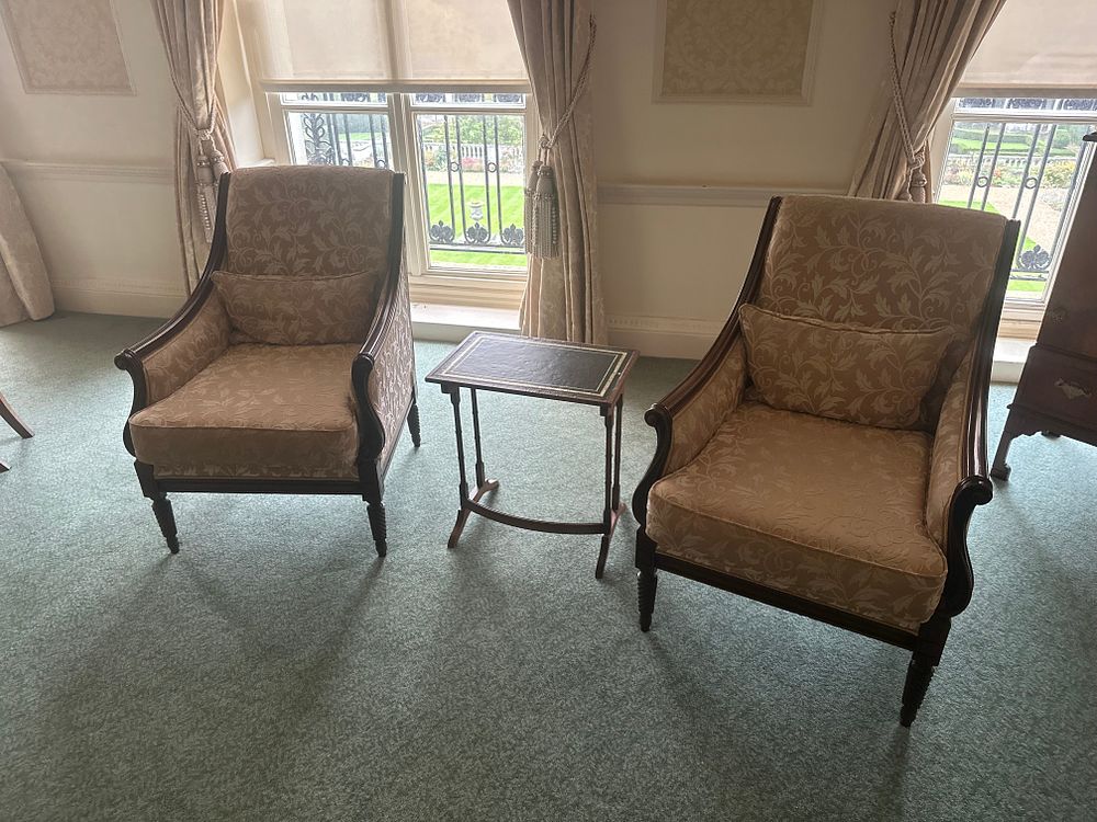 Lot 1282: A Pair of Neoclassical-Inspired Armchairs and an Occasional Table