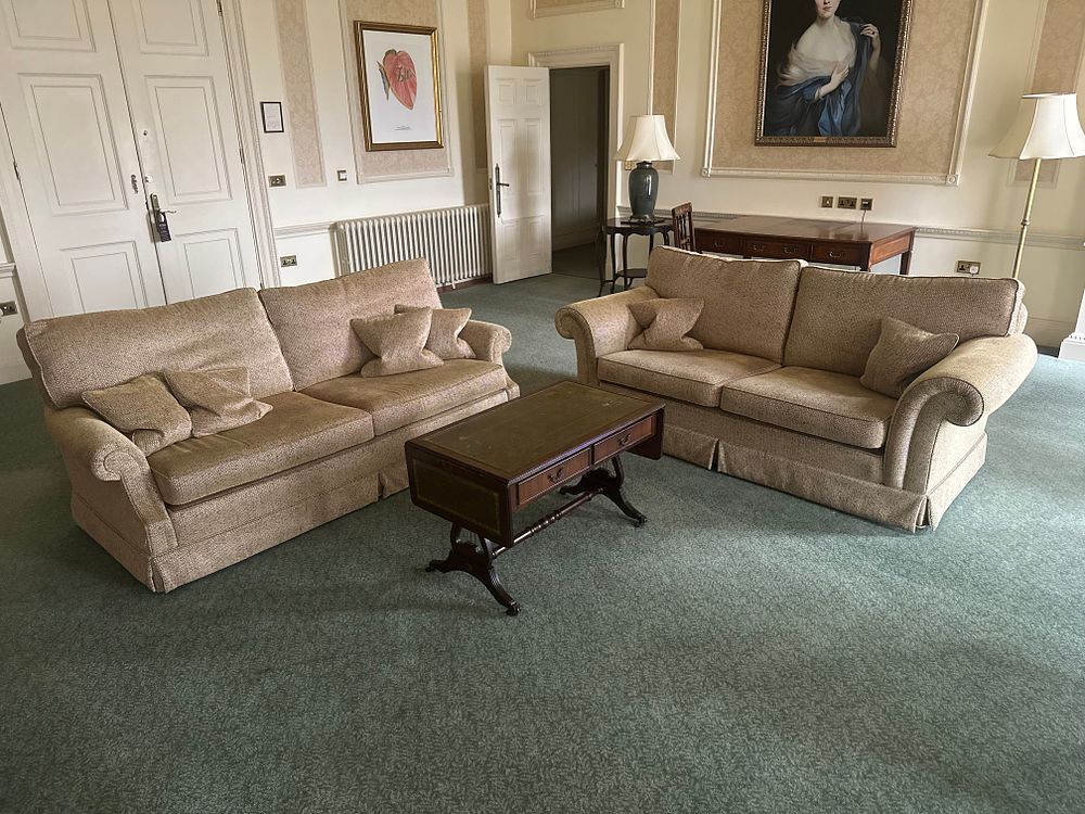 Lot 1283: A Pair of Traditional Two-Seater Sofas and a Coffee Table