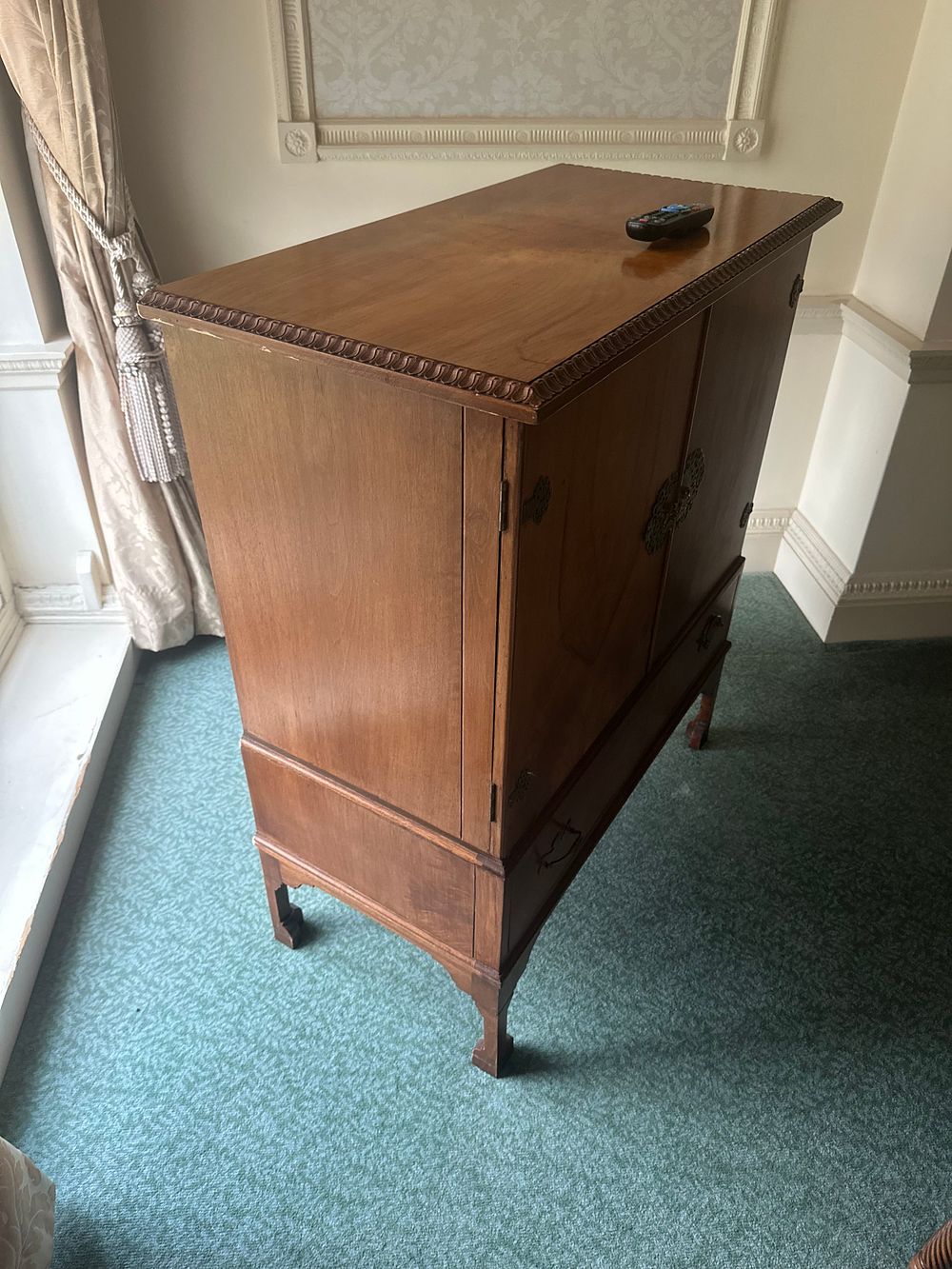Lot 1287: A Vintage Hardwood Television Cabinet with Chinoiserie Mounts, including a Toshiba Regza Television