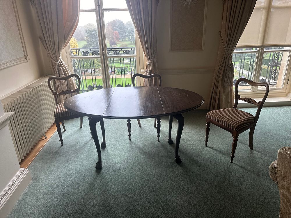 Lot 1289: A Georgian Mahogany Drop-Leaf Dining Table and Three Chairs