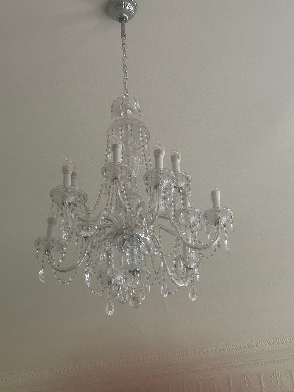 Lot 1290: A Maria Theresa Style 12-Light Crystal and Silver-Toned Metal Chandelier
