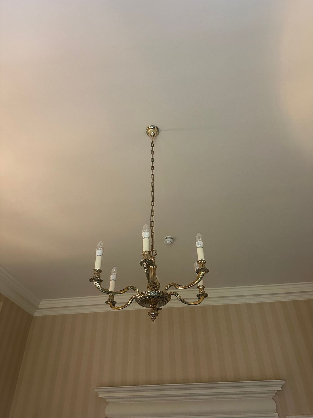 Lot 1299: An Early 20th Century French Rococo Style Six-Arm Brass Chandelier