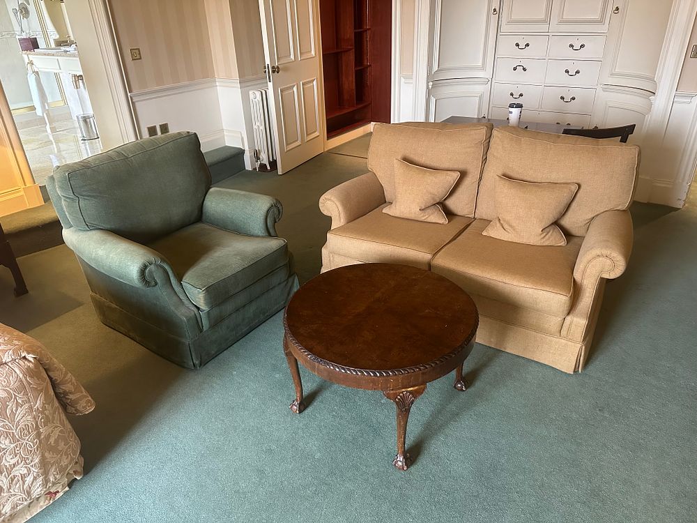 Lot 1300: A Sofa, Armchair, and Coffee Table
