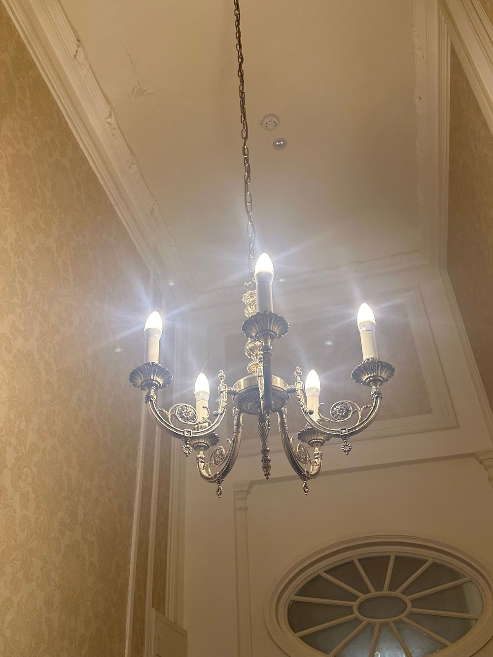 Lot 1328: A Five-Light Neoclassical Revival Style Gold-Toned Metal Chandelier