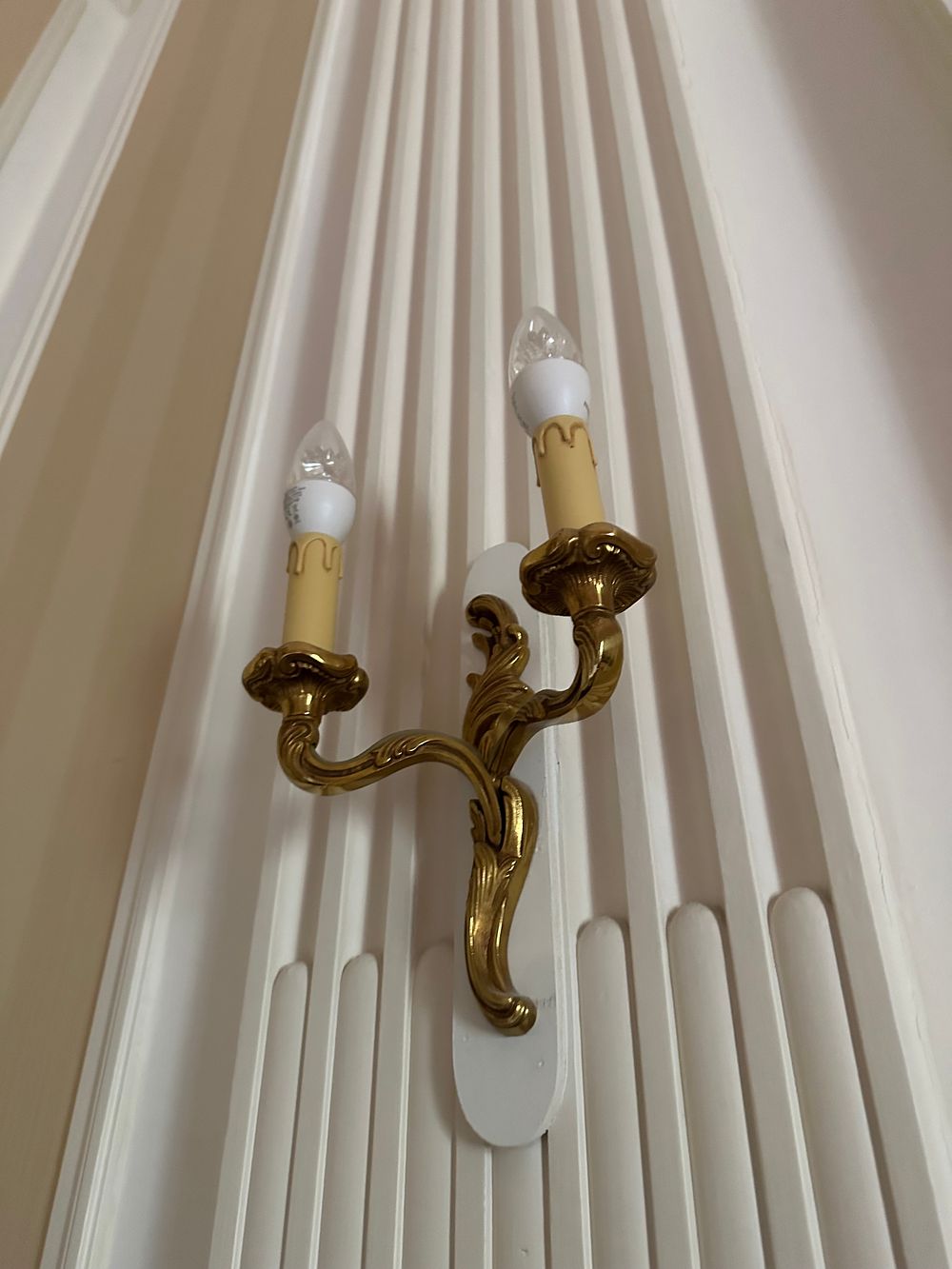 Lot 1341: A pair of French Louis XV Style Gilt Bronze Two-Light Wall Sconce, circa 1950s