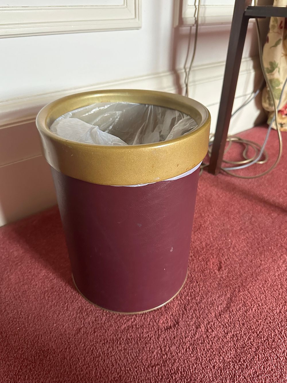 Lot 1347: A Contemporary Dark Red Faux Leather Waste Bin with Gold-Tone Rim