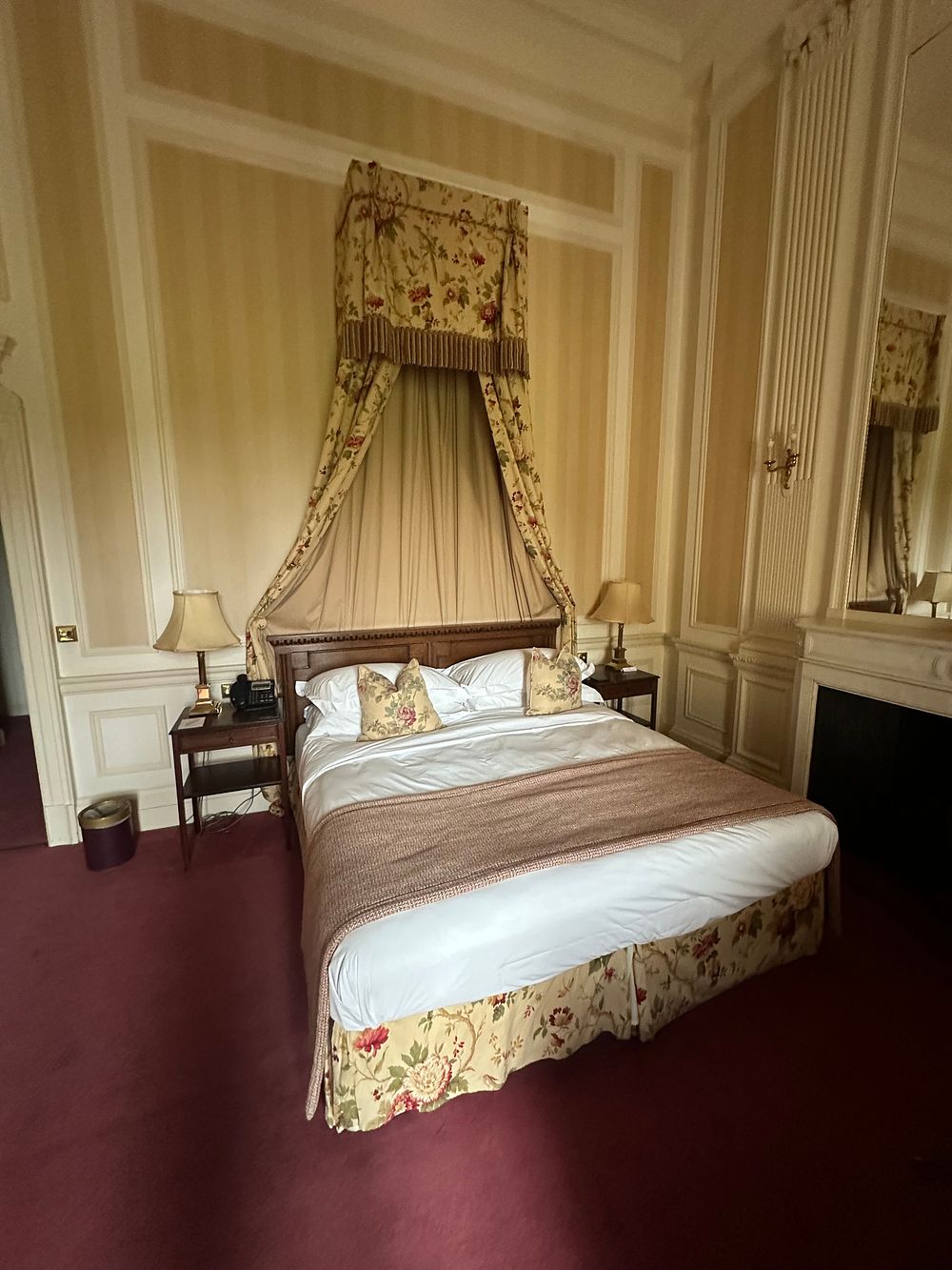 Lot 1351: A Period-Style Wooden Half-Tester Bed with Carved Headboard and Floral Chintz Draping, 180 x 200cm
