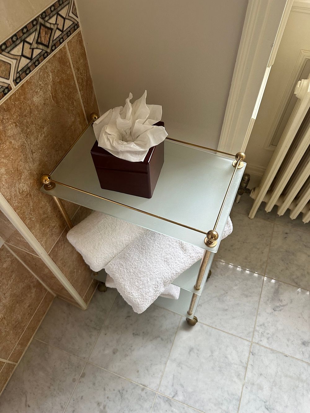 Lot 1377: A Mid-Century Modern to Contemporary Brass-Tone and Frosted Glass Three-Tiered Rolling Trolley