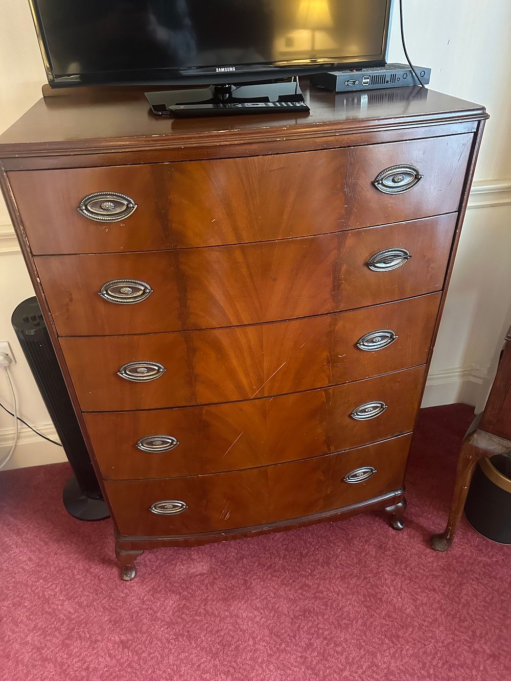 Lot 1406: A Bow-Front Mahogany Tall Chest of Drawers, likely 20th Century