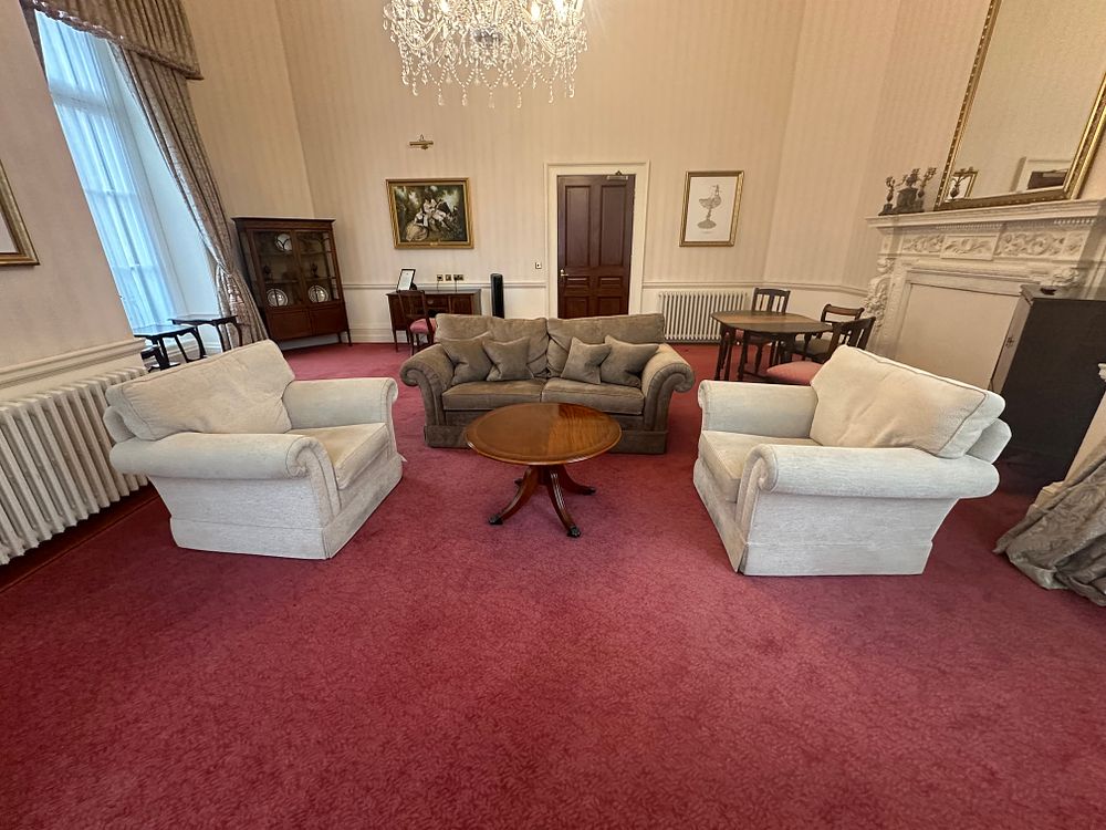Lot 1420: A Three-Piece Upholstered Seating Suite and a Classical Revival Style Coffee Table