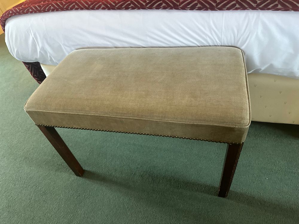 Lot 1435: A Dark-Stained Wood and Upholstered Rectangular Bench