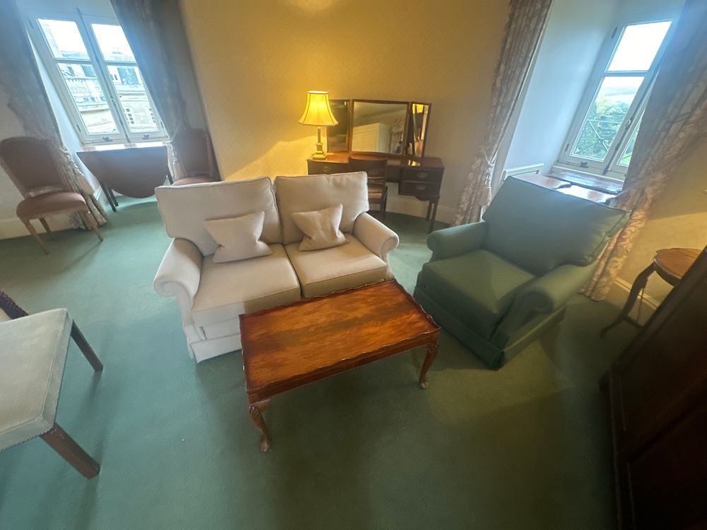 Lot 1438: A Three-Piece Traditional Living Room Suite, comprising a Coffee Table, Two-Seater Sofa, and Armchair