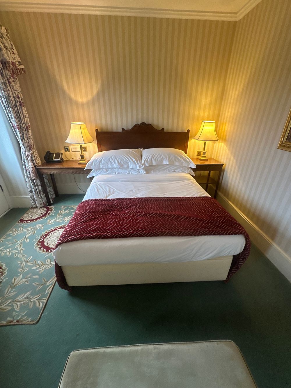 Lot 1469: A Double Bed Ensemble with Carved Headboard, Two Bedside Tables, and Two Lamps