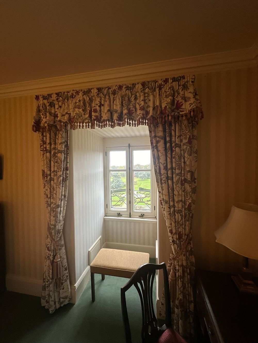 Lot 1500: A Set of Three Chintz-Style Botanical Print Drapes and Valance