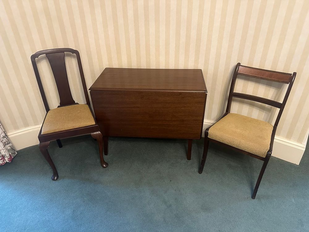 Lot 1506: A Dark-Stained Hardwood Drop-Leaf Table and Two Side Chairs, of Mixed Georgian and Regency Styles