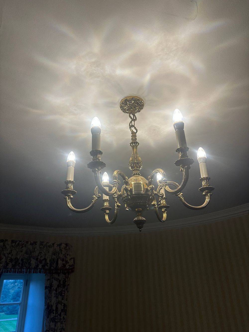 Lot 1510: A Six-Arm Brass-Toned Chandelier, in a Classical Revival Style