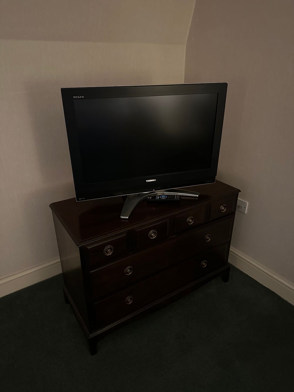 Lot 1529: A Dark-Stained Media Chest and Toshiba REGZA Flat-Screen Television