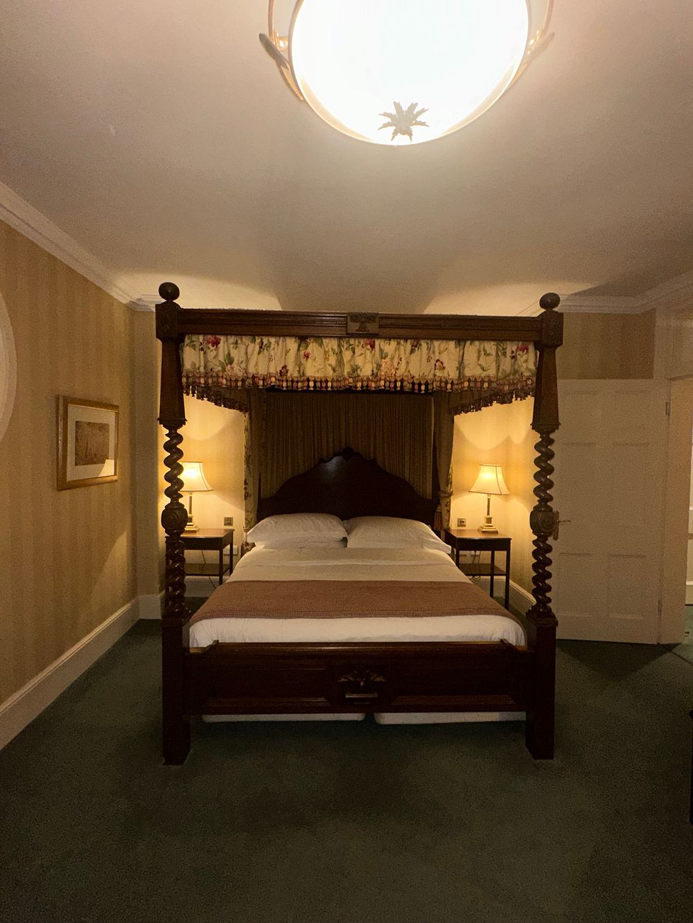 Lot 1563: A Revivalist Style Four-Poster Bed, likely Mahogany, 180 x 200cm