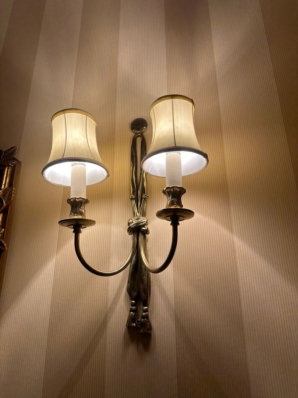 Lot 1566: A Kapoor Lamp Shades Brass Double-Arm Wall Sconce