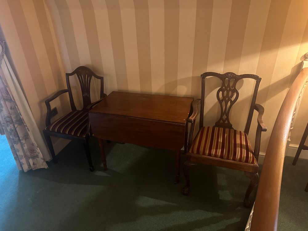 Lot 1578: A Three-Piece Mahogany or Similar Hardwood Drop-Leaf Table and Two Armchairs