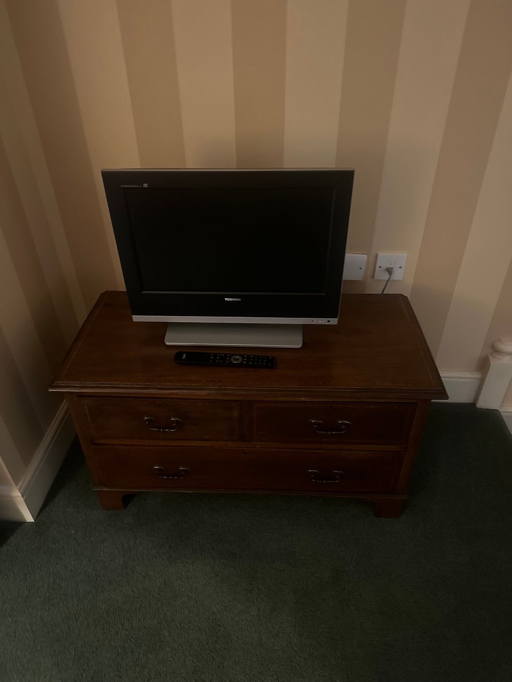 Lot 1581: A Toshiba Television and a Leick Furniture Westwood Brown Cherry TV Stand