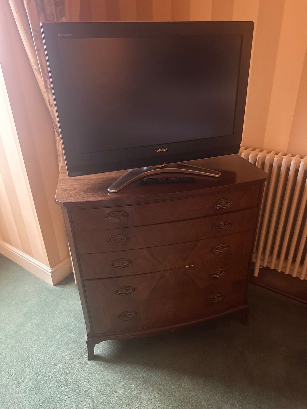 Lot 1582: A Neoclassical Style Bow-Front Chest of Drawers with a Toshiba Regza Flat-Screen Television