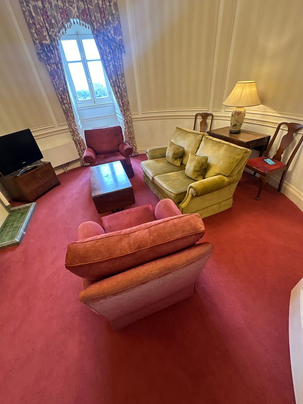 Lot 1611: A Mid-20th Century Living Room Suite, comprising a Two-Seater Sofa, Two Armchairs, and a Drop-Leaf Coffee Table