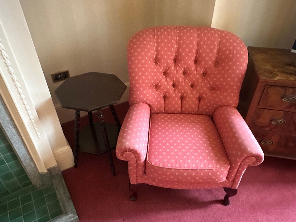 Lot 1616: A Traditional Upholstered Armchair and an Octagonal Side Table