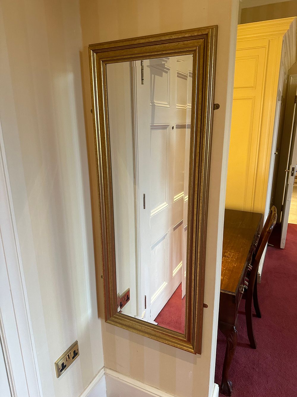Lot 1636: A Pair of Neoclassical-Inspired Gilded Wall Mirrors