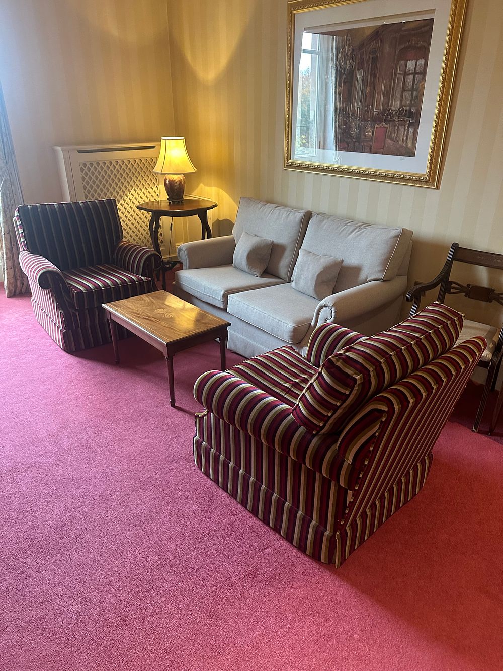 Lot 1644: A Sofa, a Pair of Armchairs and a Coffee Table, in the Traditional Style