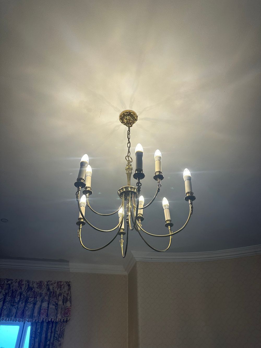 Lot 1662: A Neoclassical Style Eight-Arm Brass Chandelier