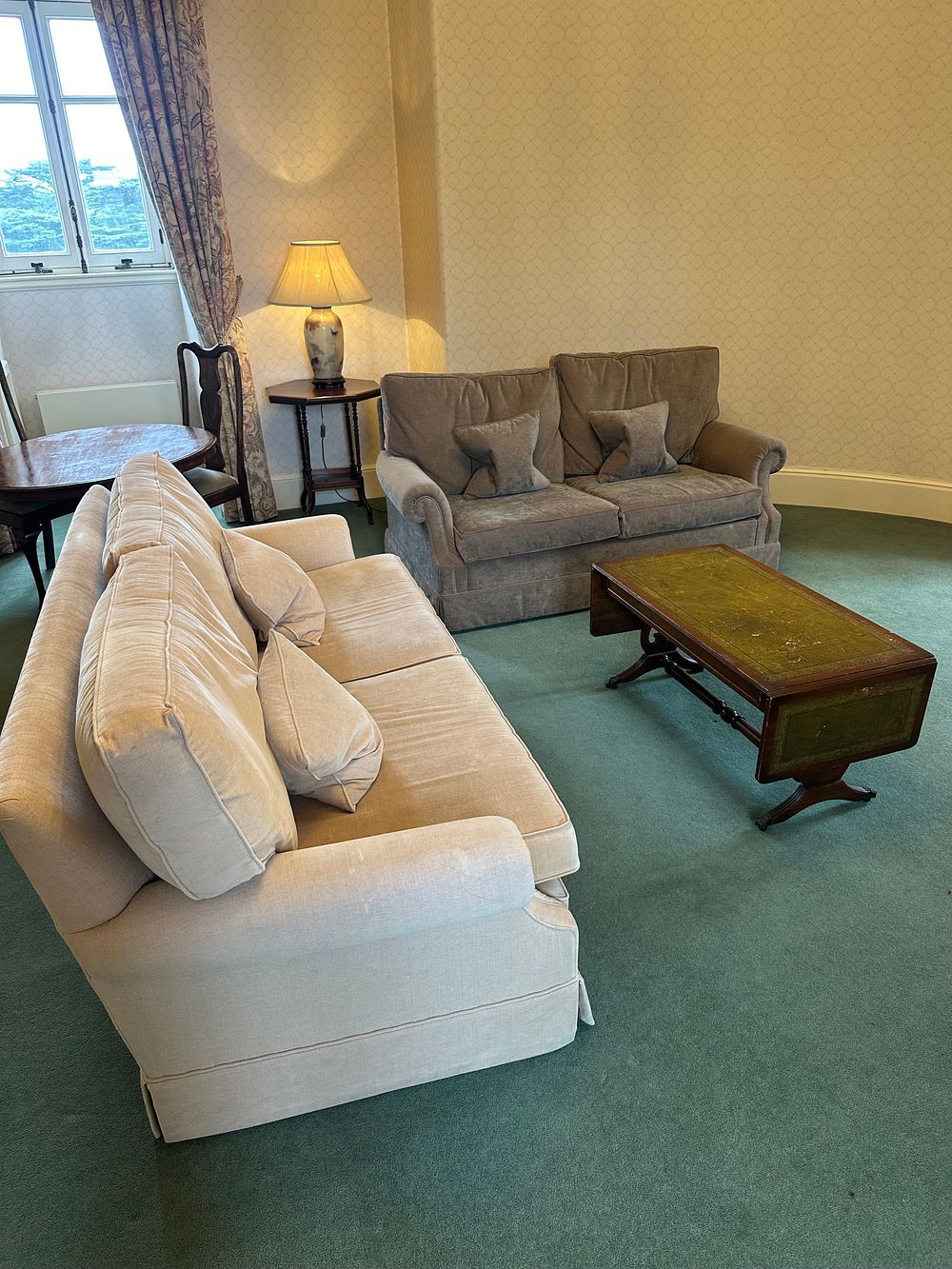 Lot 1663: A Pair of Contemporary Classic Upholstered Sofas and a Georgian Revival Style Mahogany and Tooled Leather Coffee Table
