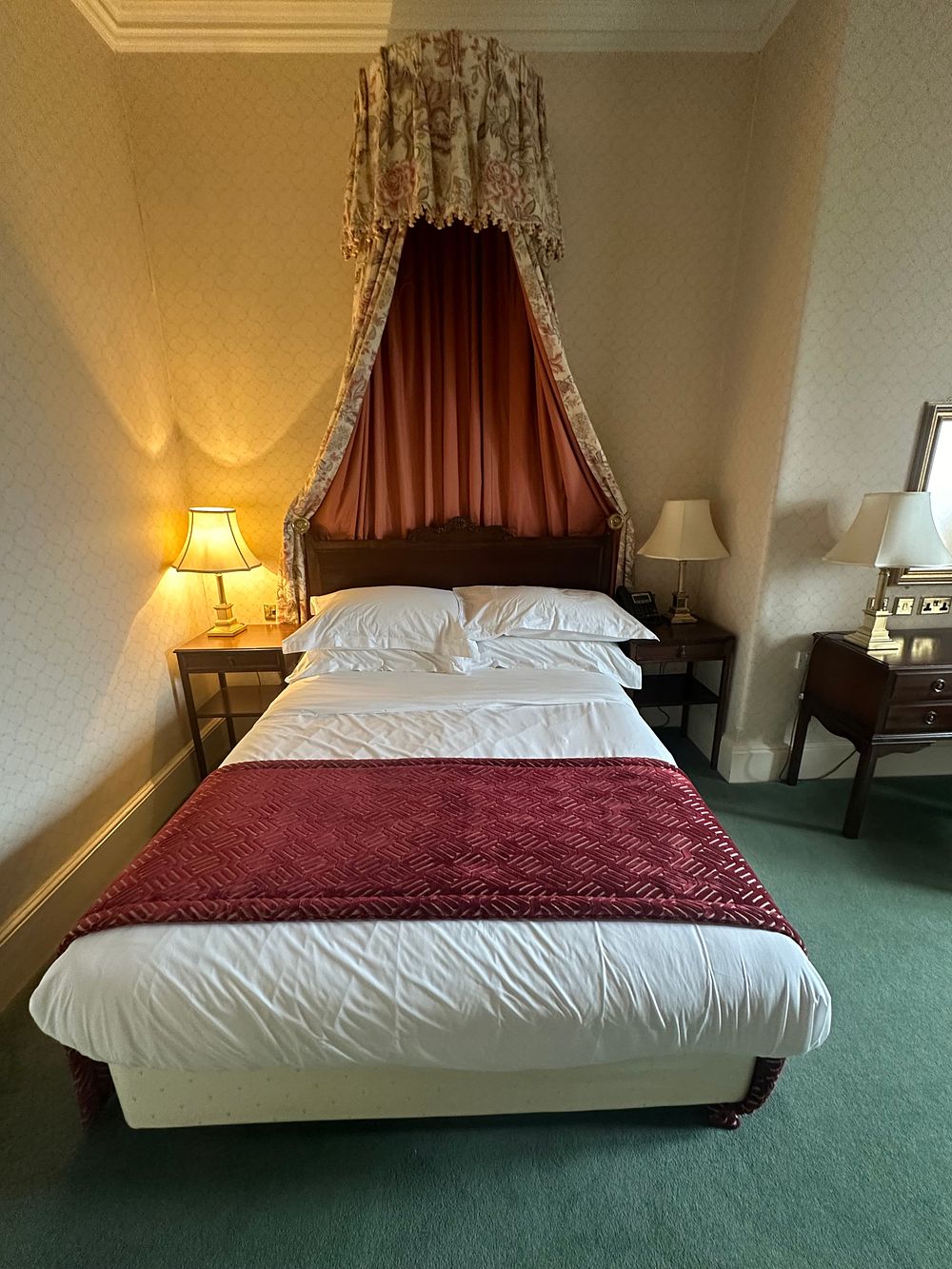 Lot 1671: A Traditional-Style Dark-Stained Wooden Headboard with Fabric Coronet Canopy