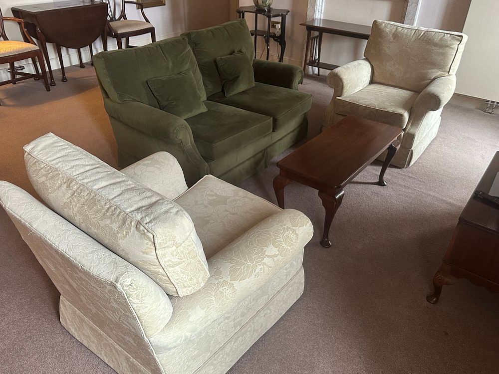 Lot 1715: A Sofa, Two Armchairs and a Coffee Table