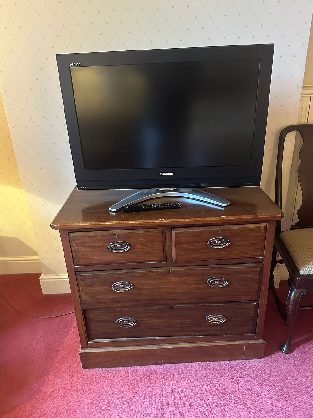 Lot 1734: A Georgian or Victorian Style Dark-Stained Chest of Drawers with a Toshiba REGZA 32-inch Flat-Screen Television