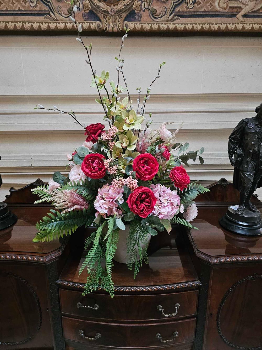 Lot 23: A Large Decorative Artificial Floral Arrangement in a Ceramic Vase