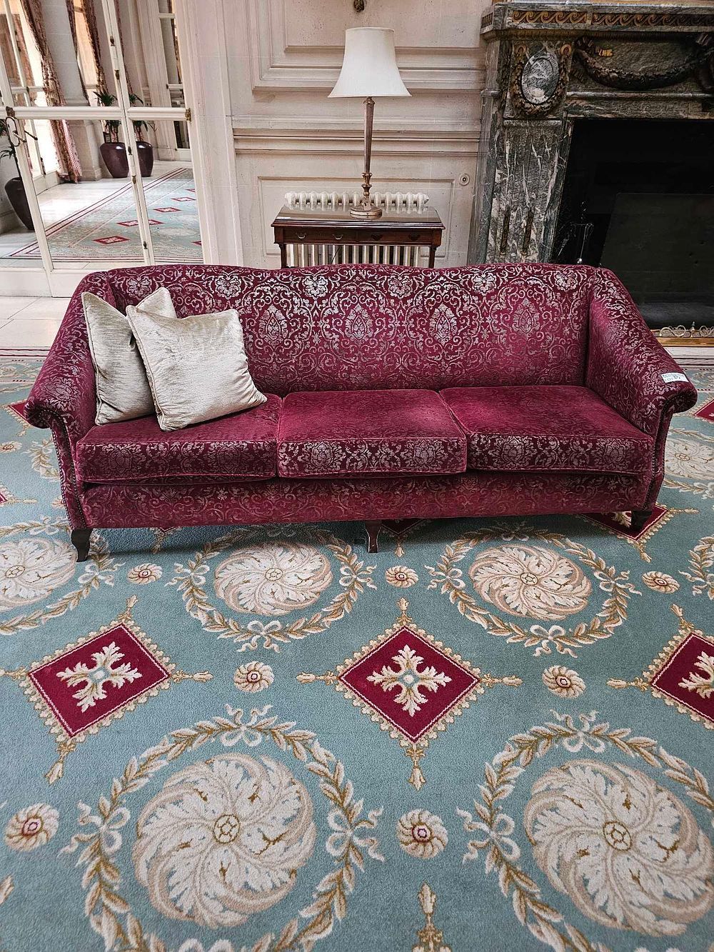 Lot 25: A Traditional Style Three-Seat Sofa, Upholstered in Red Damask Velvet